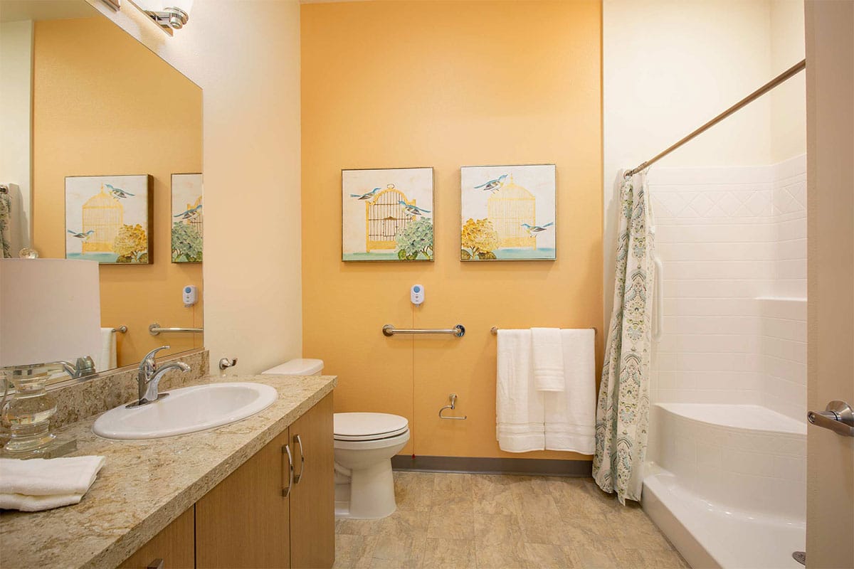 Well-appointed bathrooms have generous counter space and storage.